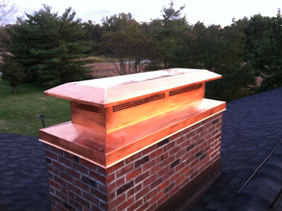 Before and after chimney cap replacement in Roosevelt, NY