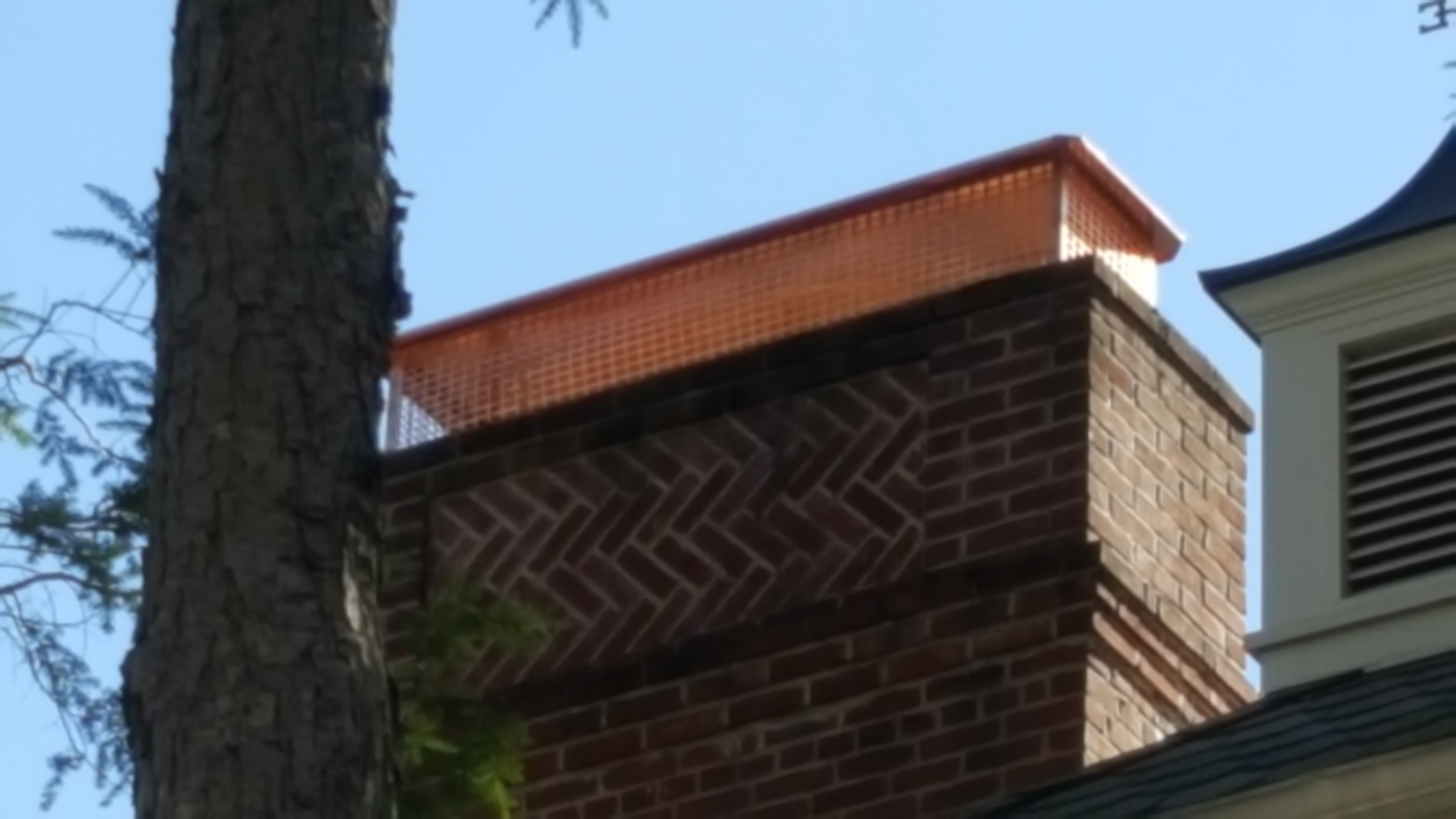 New stainless steel chimney cap installed in Roosevelt, NY