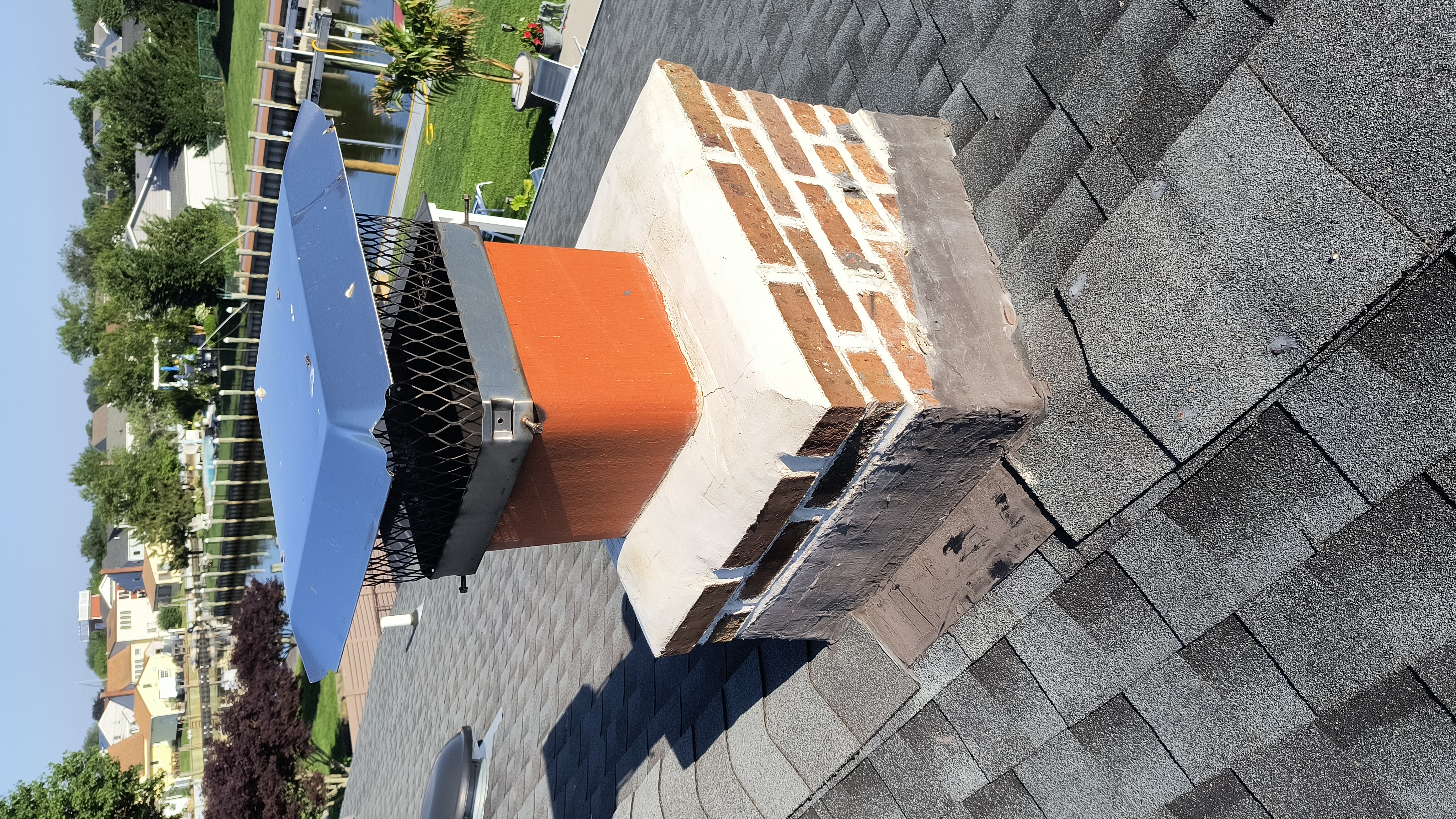 Full chimney masonry rebuild and restoration in Roosevelt, NY