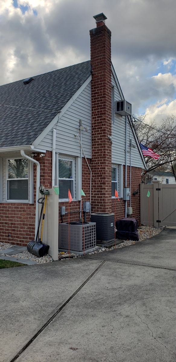Professional chimney repointing restoring brick joints in Roosevelt, NY