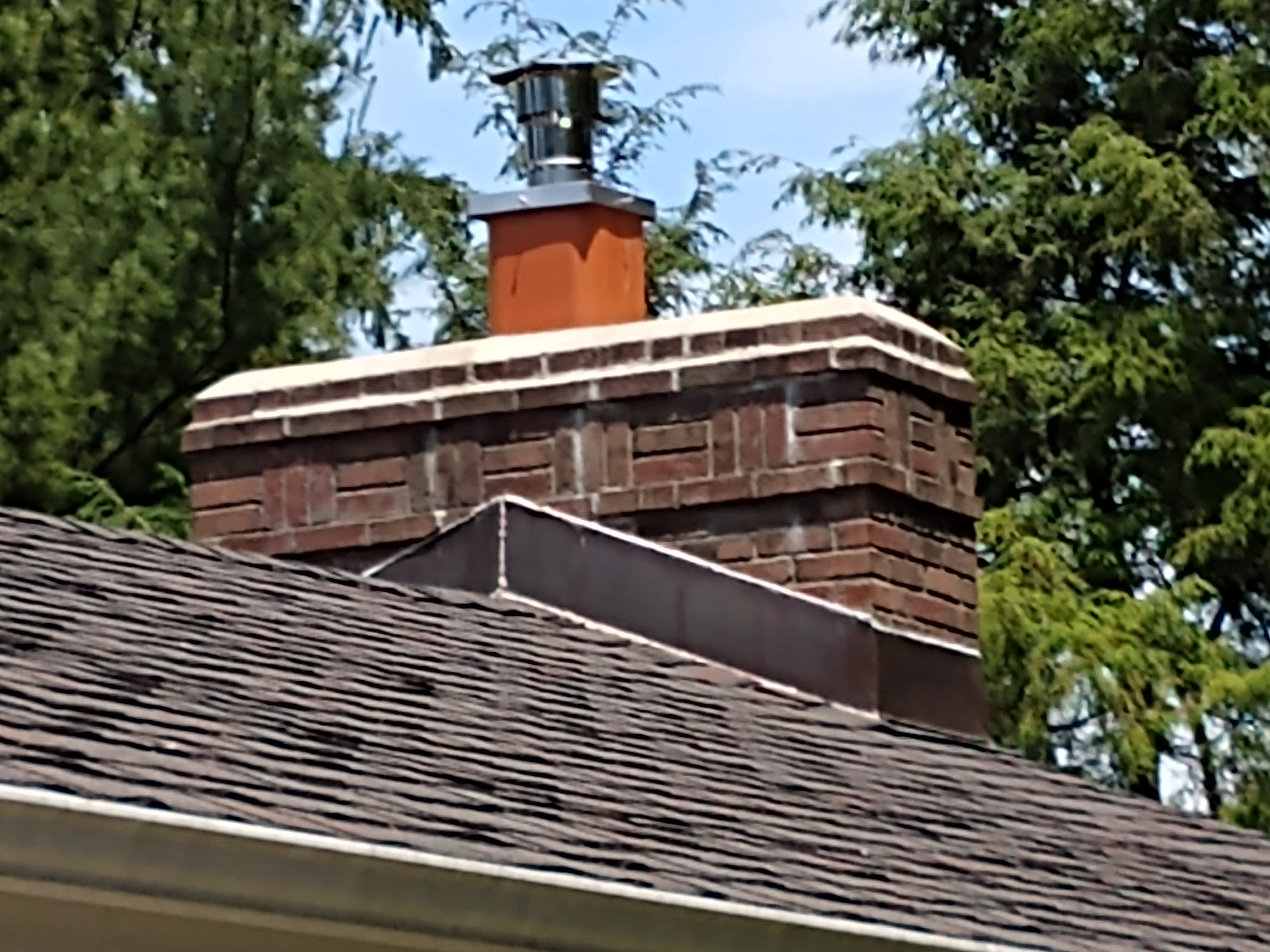 Stainless steel chimney cap with animal guard in Roosevelt, New York